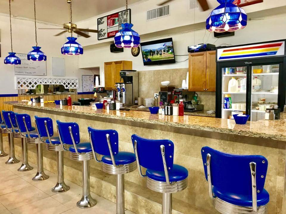 Simple diner tables and counter seating.